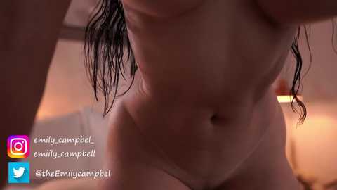 Media: Video of a nude woman with wet hair, focusing on her midsection, taken from a low angle. Background is blurred. Social media handles and watermark visible.