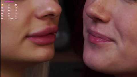 Media: Video of two close-up, side-by-side female faces with fair skin, pink lips, and dark hair, showing a subtle difference in skin tone and slight asymmetry. Background is blurred.