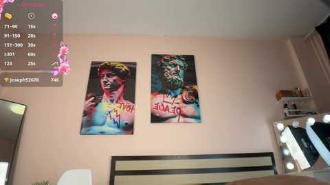 Media: Video of a bedroom with two vibrant, colorful portraits of a shirtless man with painted faces. The background includes a mirrored vanity and a bed with a beige headboard.