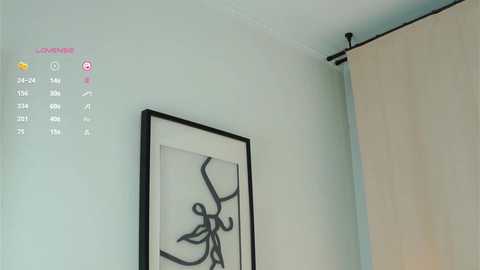 Media: Video of a minimalist room with a calendar overlay showing May 7th. A modern, abstract painting hangs on a light green wall, next to a beige curtain.