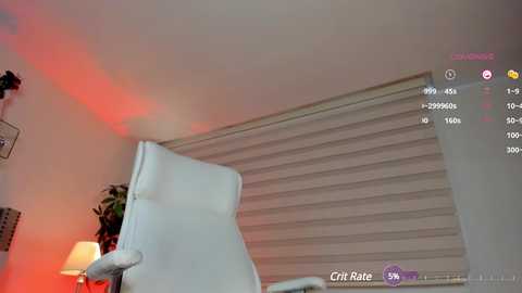 Media: Video of a modern, dimly lit room with a white leather armchair, a window with white blinds, a red lamp on a side table, and a \"Cristi Rute\" watermark in the corner.