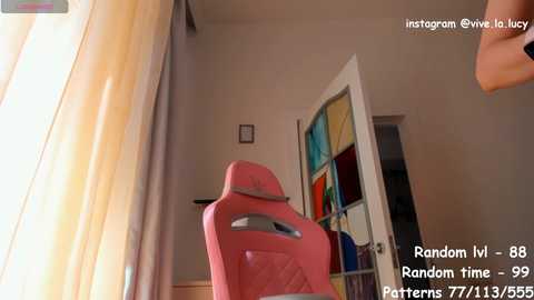 Media: Video of a bright, modern living room with a pink gaming chair, colorful stained-glass window, and beige curtains. Text overlay: \"Random lv-88, Random Time-99, Patterns 77/1135.\