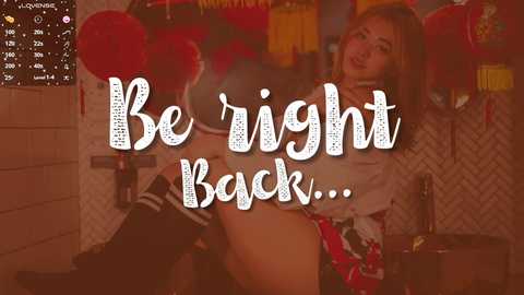 Media: A video featuring a sultry woman in a revealing, red and white plaid outfit, with a playful \"Be right back...\" text overlay.