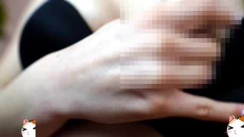 Media: A close-up video of a Caucasian woman with fair skin, wearing a black bra, her face blurred, and a hand in a black glove, partially obscuring her breast.