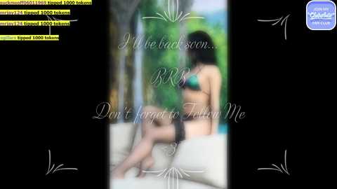 Media: A blurred video of a woman in a green bikini sitting on a white cushioned chair, surrounded by a lush green backdrop. Text overlays read \"I Be Bad... Don't Forget to Follow Me.\