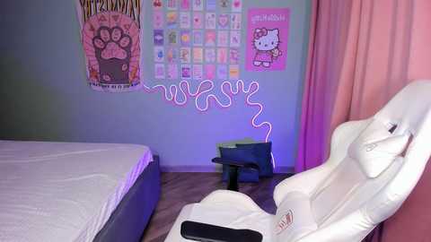 Media: A video of a cozy, pastel-themed bedroom with a white gaming chair, a twin bed, and a pink Hello Kitty wall.