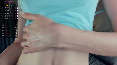 Media: A close-up video of a person's pale, smooth thigh and foot, with a hand resting on the thigh. The background features a smartphone screen with a \"LOOMI\" app displaying a body scan interface.