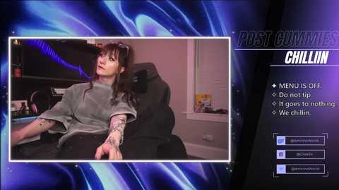 Media: A video of a tattooed woman in a gray shirt, sitting in a black chair, with a blue neon background and \"POST GUTTER CHILLIN\" text.