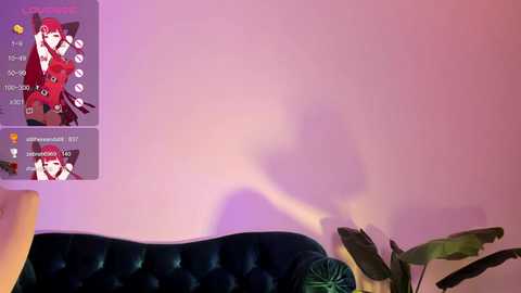 Media: A video of a pink wall with a virtual cat avatar, a dark green velvet sofa, and a green plant in the foreground.