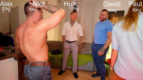 Media: Video of four people in a living room: shirtless man, two men in casual clothes, and a woman. Names, ages, and weights are displayed above each.