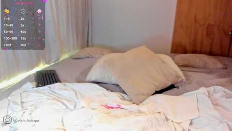 Media: Video of a messy bedroom with white bedding, a black fan on the left, and a wooden wall on the right. A digital calendar with dates and tasks is overlaid.