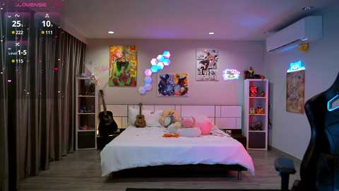 Media: A colorful, vibrant bedroom with a queen-sized bed, white walls adorned with art, and a mix of neon lights and posters.