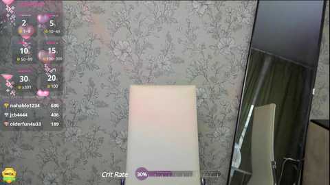 Media: Video of a dimly lit room with a white chair against a gray floral wallpaper, featuring a \"Game\" overlay with a score of 30,000.