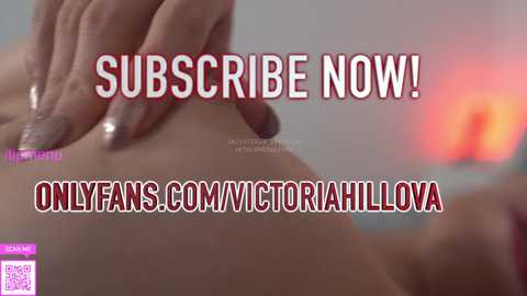 Media: A close-up video of a woman's hand with glittery nails caressing her skin. Text overlay promotes \"Subscribe Now!\" and \"OnlyFans.com/victoriahillova.\" Background is blurred, with warm tones.