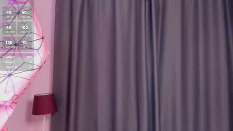 Media: Video of a room with a purple curtain, a maroon lampshade, and a colorful, geometrically patterned wall clock. The scene exudes a cozy, modern aesthetic.