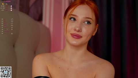 Media: Photorealistic CGI of a young redheaded woman with fair skin, blue eyes, and full lips, wearing a black off-shoulder top, against a blurred pink and black background.