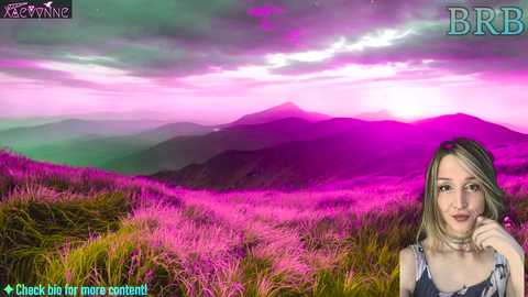 Media: A vibrant, digital photo features a young woman with shoulder-length blonde hair, dressed in a casual top, smiling against a surreal, neon-lit pink and purple landscape with a mountain range.