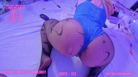 Media: Video of a woman in a blue bodysuit and fishnet stockings, on all fours on a bed, with a pink and purple backdrop. Text overlays include \"OnlyFans.com/onlydoublebutt\" and \"SHOTS: 235.\