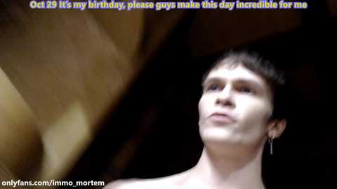 Media: A blurry video of a shirtless young man with short dark hair, standing in a dimly lit room, with text overlaid: \"Oct 29: It's my birthday, please guys make this day incredible for me.\