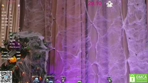 Media: A screenshot from a virtual reality game shows a purple-hued, web-covered cave with a glowing ghost icon at the top, indicating a haunted setting.