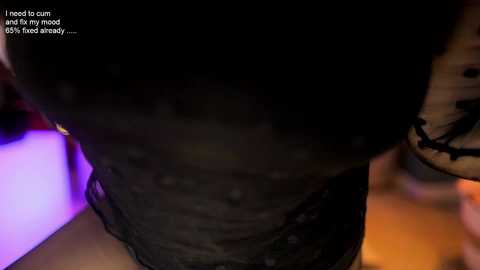 Media: A close-up CGI image of a person with dark skin, wearing a black lace bra and panties, with a blurred background. The text reads, \"I need cum and I need it bad.\