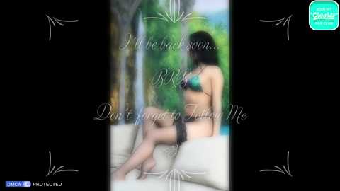 Media: A blurred video of a woman in a bikini, sitting on a white couch, with greenery and a blue sky in the background. Text overlays the image with a motivational message.