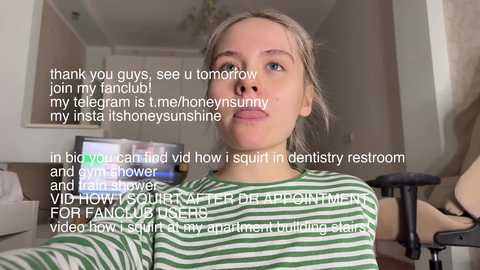 Media: Video of a blonde woman with a straight face, wearing a green-and-white striped shirt, in a home setting. Text overlays her image, describing a dental visit.