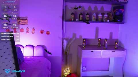 Media: Video of a bedroom with purple lighting; a bed, a shelf with bottles, and a desk with a plant.