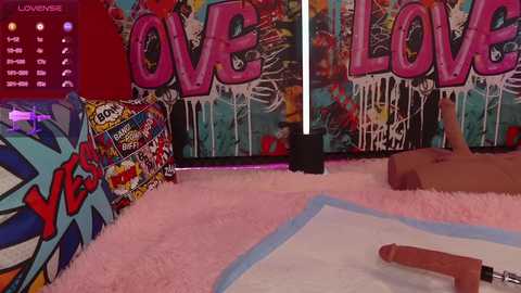 Media: Video of a vibrant, colorful room with graffiti walls, a plush pink rug, a blue pool table, and a large \"LOVE\" sign.