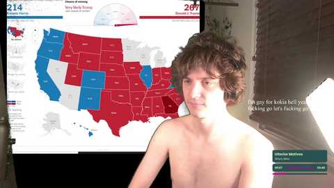 Media: Video of a shirtless young man with curly brown hair, standing in front of a map of the US, highlighting red and blue states. Text overlay: \"I've just got back from voting. I'm fucking livid you're not.\