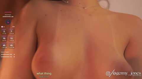 Media: Close-up video of a light-skinned woman's back, showing small moles and freckles. The background is blurred. Text on the left indicates \"what-trang\" and \"what-trang.com.\