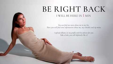 Media: Video of a young woman with straight, dark hair, wearing a beige, spaghetti-strap dress, seated on a white floor, gazing thoughtfully to the left. Text overlays: \"BE RIGHT BACK\" in bold, followed by a quote about a baby.