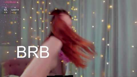 Media: A blurry photo of a nude woman with long, red hair, captured from a low angle, surrounded by sparkly lights. Text \"BBR\" and \"Level 4\" overlay.