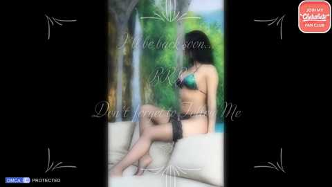 Media: Video of a slender woman in black lingerie, sitting on a couch, with a blurred tropical background. Text overlay: \"You be the boss... Don't let them tell you.\