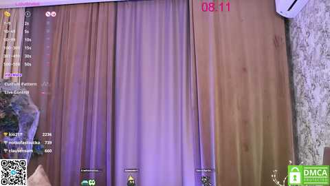 Media: A video of a dimly lit room with a wooden door and a purple curtain, displaying a QR code and a DMI logo in the bottom right corner.