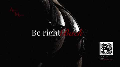 Media: Video of a dark-skinned woman with large breasts, wearing a black lace bra, against a black background. Text reads, \"Be right back,\" in white and red. QR code and website URL on right.