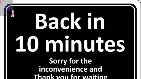 Media: Video of a black road sign with white text: \"Back in 10 minutes,\" followed by \"Sorry for the inconvenience and Thank you for waiting.\