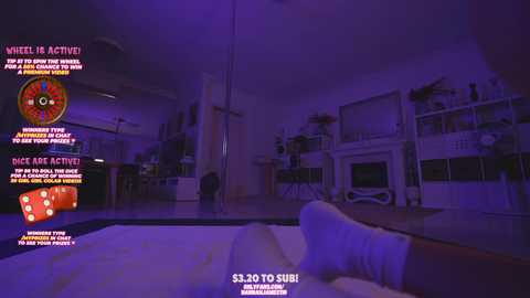 Media: Video of a dimly lit, neon-lit room with purple hues, featuring a roulette wheel, a dice table, and a white sofa.