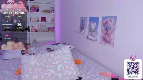 Media: Video of a pastel-colored bedroom with white walls, featuring a bed with Hello Kitty bedding, Hello Kitty posters, and plush toys.