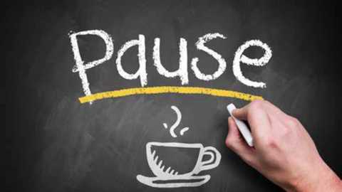 Media: A video of a chalkboard with the word \"Pause\" written in white chalk, featuring a cup of steaming coffee and a yellow ruler. A hand is holding a white chalk in the bottom right corner, drawing the cup.