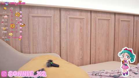 Media: Video of a bedroom with a light wooden headboard, featuring a chibi anime girl with green hair and pink accessories. A yellow pillow and a black hairbrush are visible on the bed.