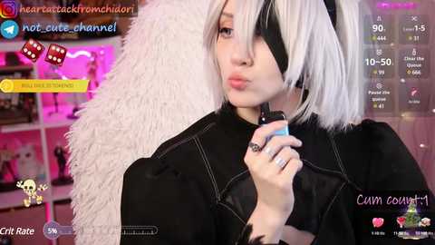 Media: Video of a woman in a black cosplay outfit with white hair, wearing a black eye patch, and holding a cigarette. Background features a pink and purple neon-lit room.