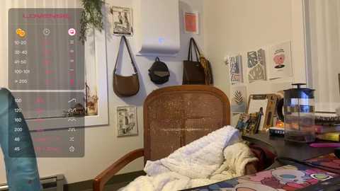 Media: Video of a cozy bedroom with a cluttered desk, a wooden headboard, various framed photos, a white quilt, and a blue chair, overlaid with a smartphone screen showing a weather app.