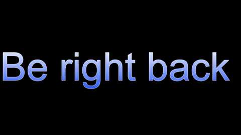 Media: A digital image featuring the phrase \"Be right back\" in white, lowercase letters against a solid black background, with a gradient blue background effect. The text is centered horizontally and vertically.