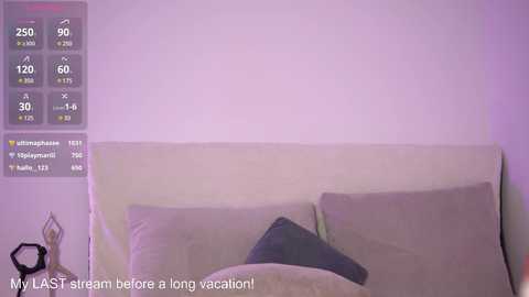 Media: Video of a beige couch with a dark grey pillow, set against a lavender wall, with a digital clock displaying 23:30. Text at the bottom reads, \"MY LAST STRIP BEFORE A LONG VACATION!\