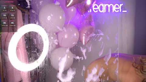 Media: A CGI image of a man in a shower, surrounded by soap bubbles and a white circle, with \"streamer\" text in purple.