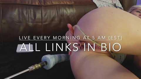 Media: Video of a close-up, intimate scene: a woman's bare buttocks and genitals being penetrated by a large, vibrating wand; text overlay reads: \"Live Every Morning at 5 AM (EST) All Links In Bio.\