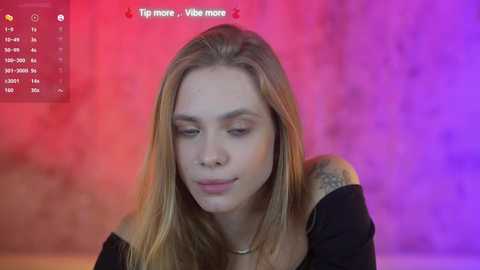 Media: Video of a young woman with long, straight blonde hair, wearing a black off-shoulder top, smiling softly, with a purple and pink background. Text on screen: \"Tip more, vibe more.\