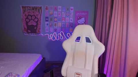 Media: Video of a room with a white gaming chair, purple lighting, pink curtains, and a wall adorned with anime posters.