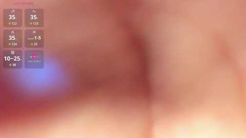 Media: A blurred close-up video of a human anus with a digital overlay showing a thermometer reading 35\u00b0C and a pink heart icon. The background is a soft, pinkish hue.